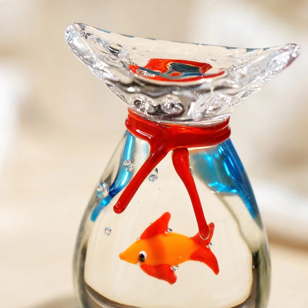 Close detail of rounded glass goldfish ornament rim